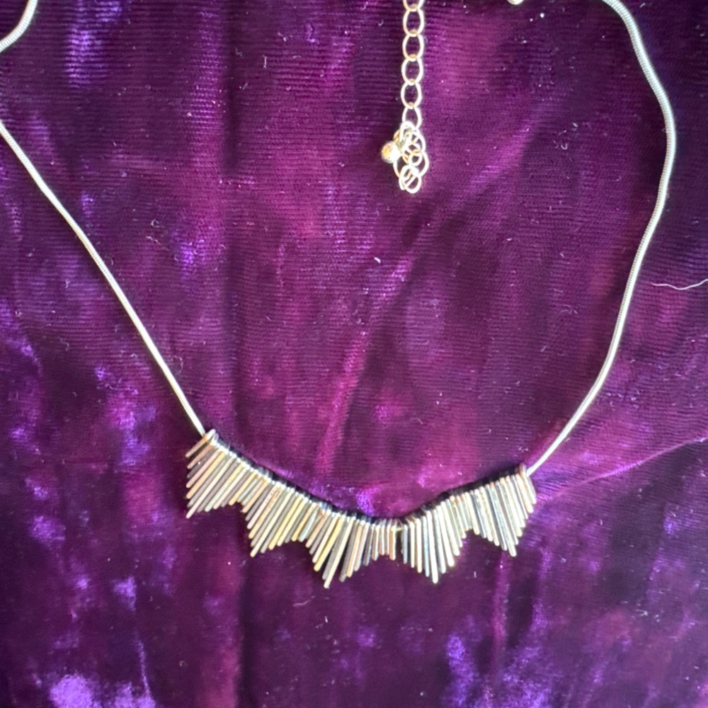Edgy mixed metals icicle sunburst style necklace